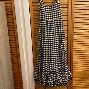 Gingham dress with black eyelet detail at hem